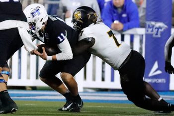 Middle Tennessee quarterback Nicholas Vattiato (11) gets sacked by Kennesaw State linebacker Garland Benyard (7) during the football game at MTSU, on Tuesday, Oct. 15, 2024.