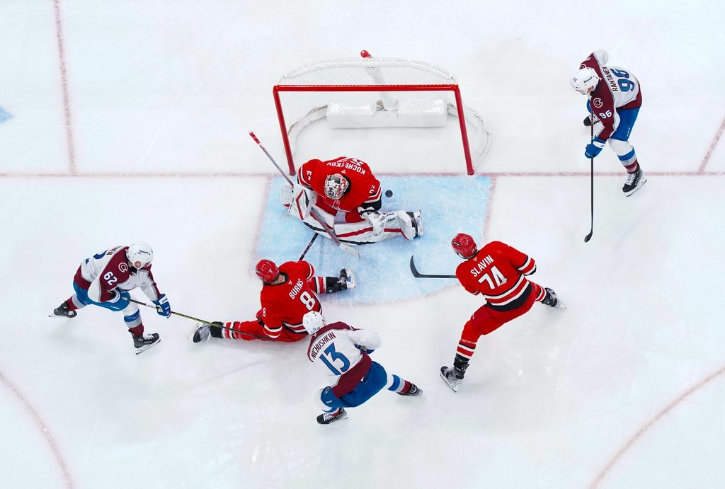 Dec 5, 2024; Raleigh, North Carolina, USA; Colorado Avalanche right wing Valeri Nichushkin (13) scores a goal past Carolina Hurricanes goaltender Pyotr Kochetkov (52) defenseman Brent Burns (8) and defenseman Jaccob Slavin (74) during the third period at Lenovo Center. Mandatory Credit: James Guillory-Imagn Images