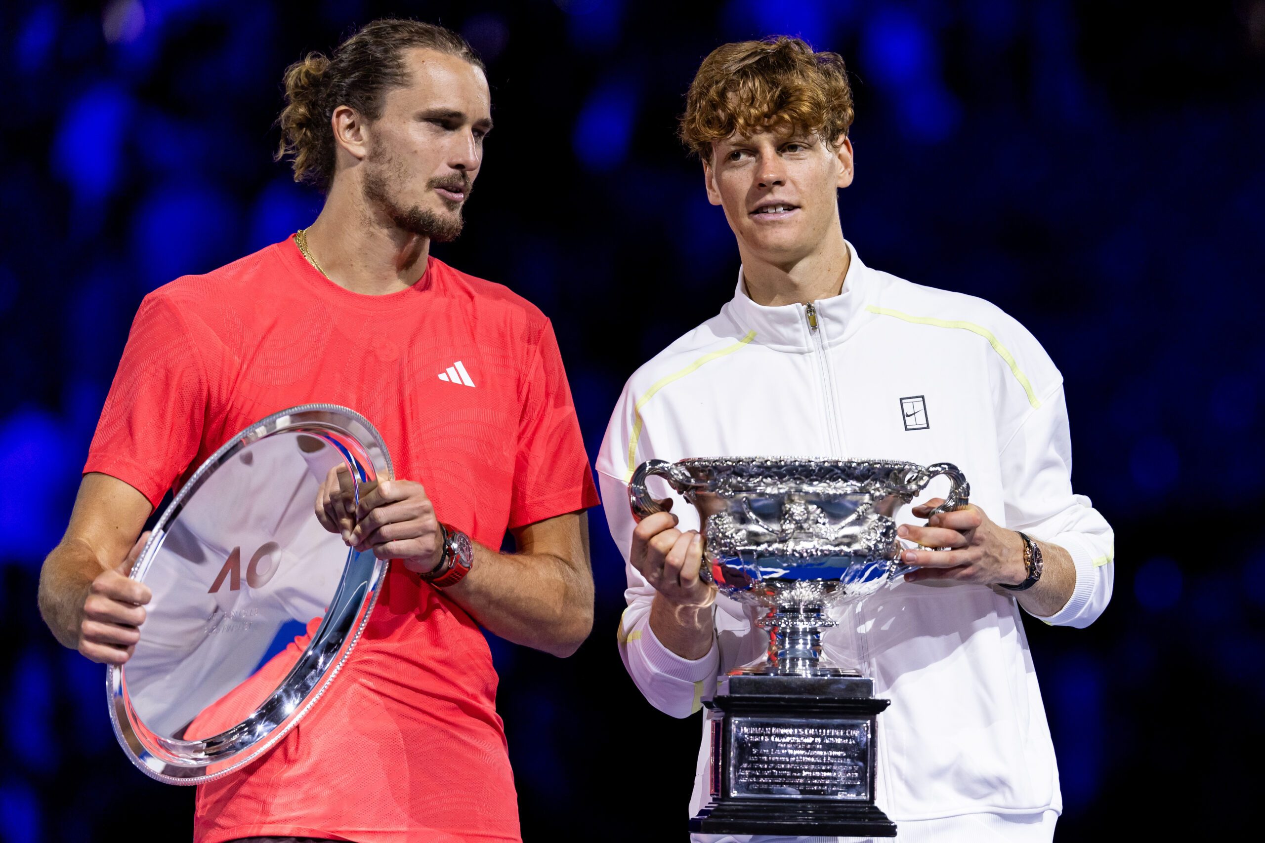 Jan 26, 2025; Melbourne, Victoria, Australia; Jannik Sinner of Italy and Alexander Zverev of Germany share a moment during the prize presentation of the men's single final at the 2025 Australian Open at Melbourne Park. Mandatory Credit: Mike Frey-Imagn Images