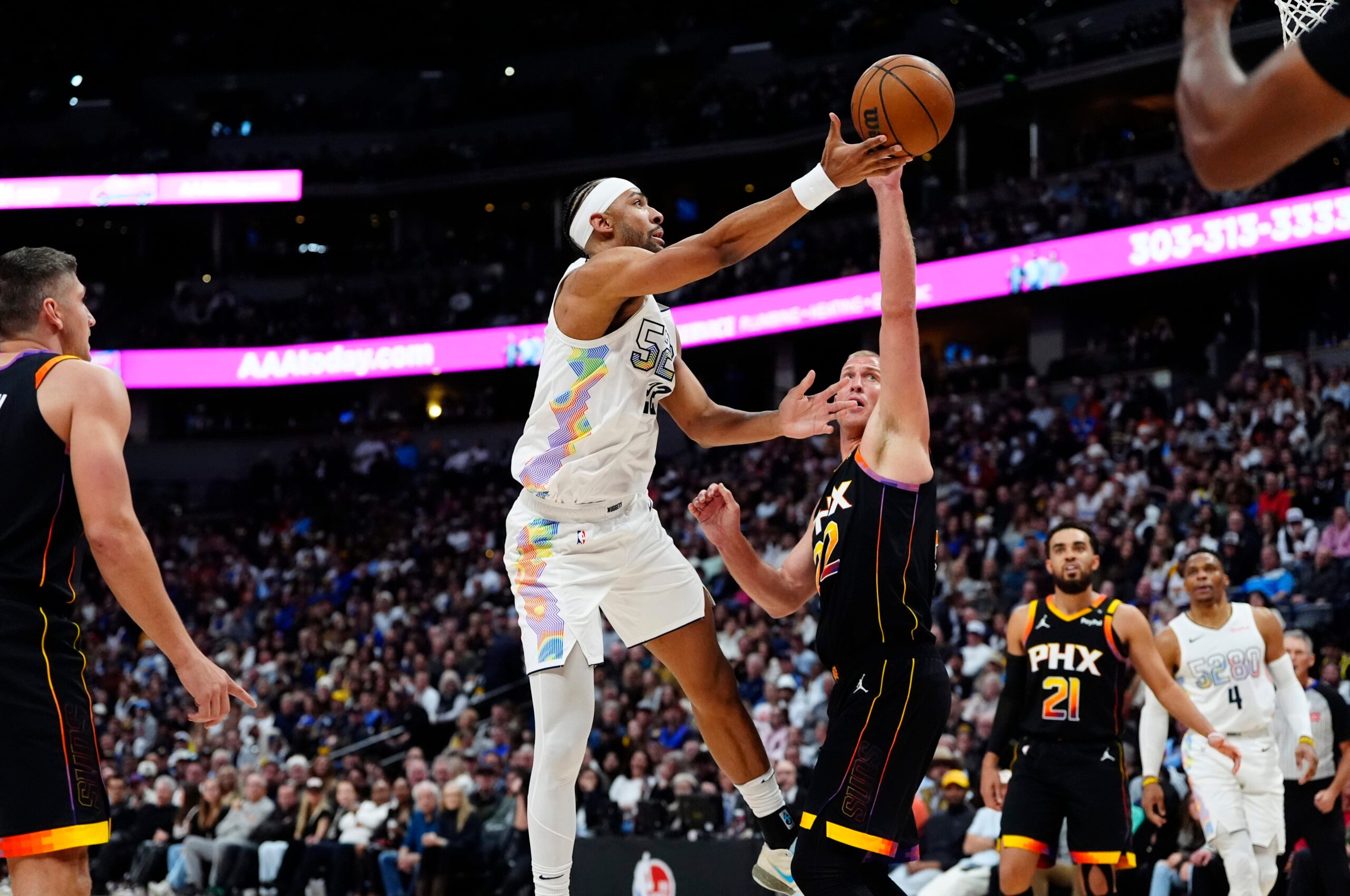 Mar 7, 2025; Denver, Colorado, USA; Phoenix Suns center Mason Plumlee (22) defends on Denver Nuggets forward Zeke Nnaji (22) in the second half at Ball Arena. Mandatory Credit: Ron Chenoy-Imagn Images