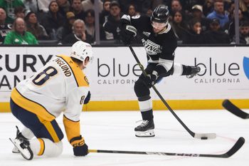 Mar 15, 2025; Los Angeles, California, USA;  Los Angeles Kings right wing Adrian Kempe (9) looks to shoot against the Nashville Predators during the second period of a hockey game at Crypto.com Arena. Mandatory Credit: Jessica Alcheh-Imagn Images