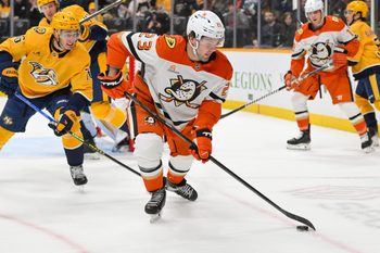 Mar 20, 2025; Nashville, Tennessee, USA;  Anaheim Ducks center Mason McTavish (23) skates with the puck against the Nashville Predators during the second period at Bridgestone Arena. Mandatory Credit: Steve Roberts-Imagn Images