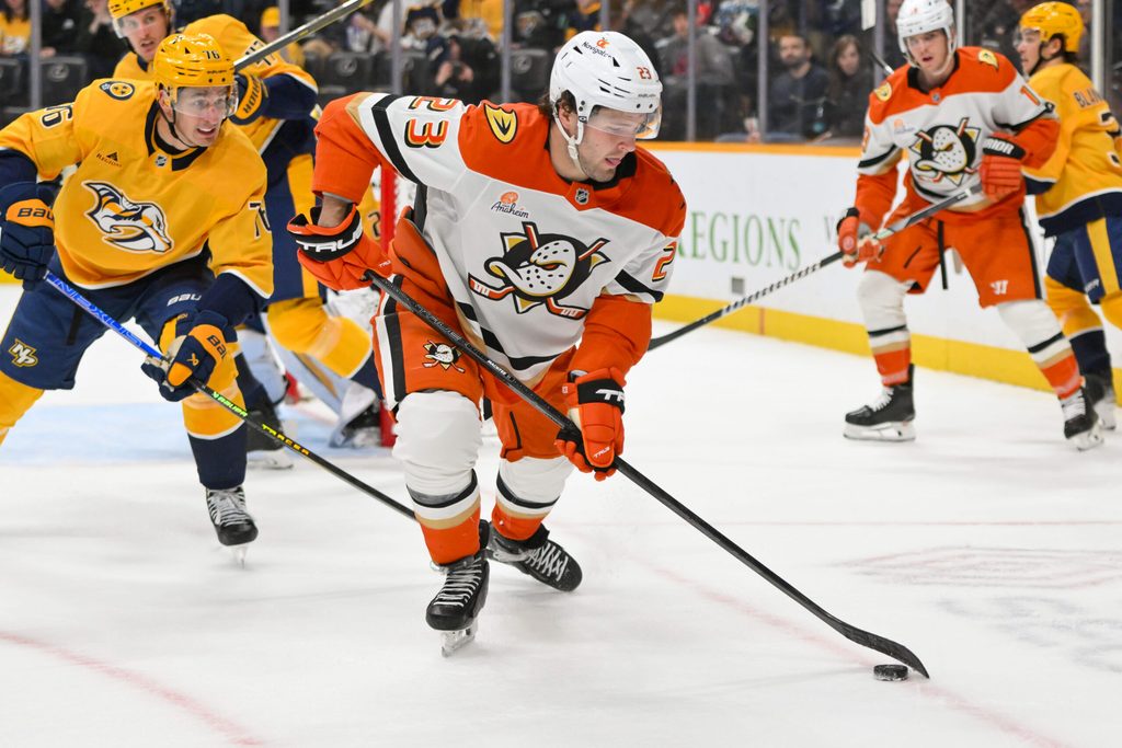 Mar 20, 2025; Nashville, Tennessee, USA; Anaheim Ducks center Mason McTavish (23) skates with the puck against the Nashville Predators during the second period at Bridgestone Arena. Mandatory Credit: Steve Roberts-Imagn Images
