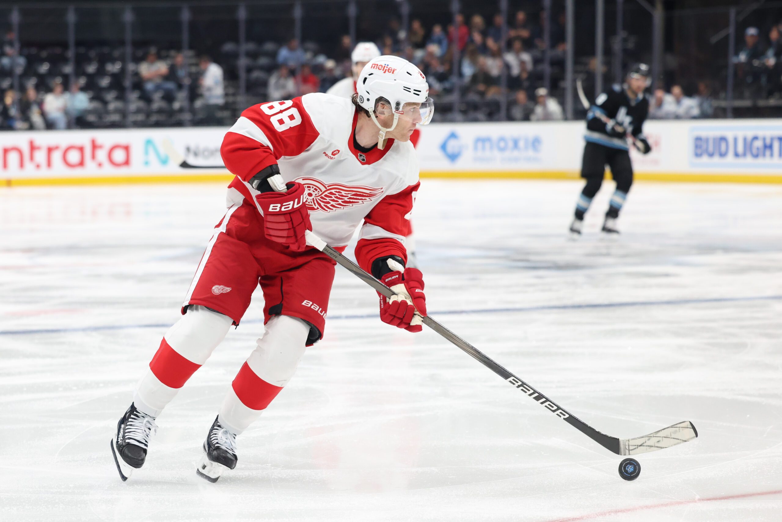 Mar 24, 2025; Salt Lake City, Utah, USA; Detroit Red Wings right wing Patrick Kane (88) skates with the puck against the Utah Hockey Club during the second period at Delta Center. Mandatory Credit: Rob Gray-Imagn Images