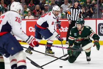 Mar 27, 2025; Saint Paul, Minnesota, USA; Washington Capitals left wing Alex Ovechkin (8) passes the puck against the Minnesota Wild during the second period at Xcel Energy Center. Mandatory Credit: Matt Krohn-Imagn Images