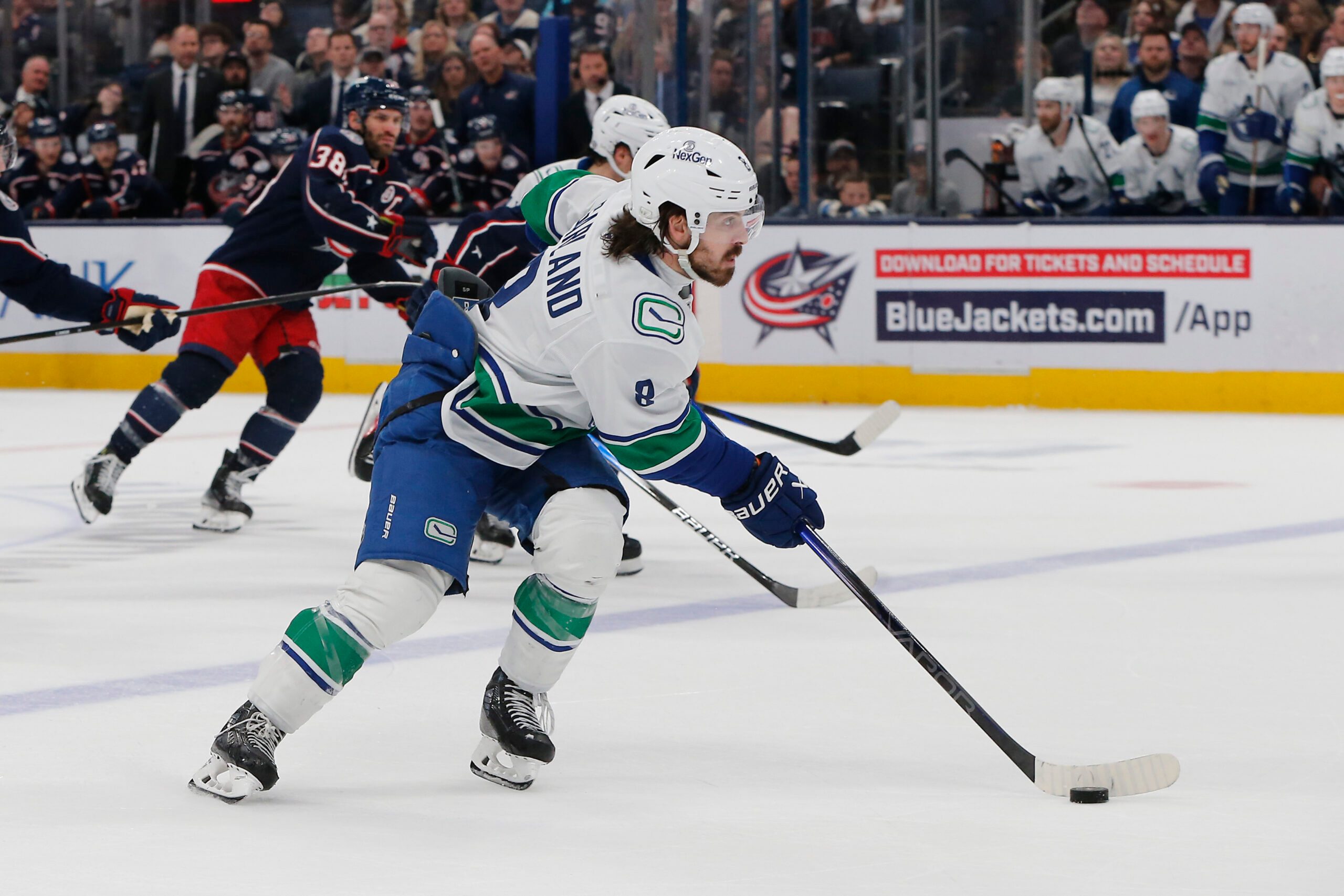 Mar 28, 2025; Columbus, Ohio, USA; Vancouver Canucks right wing Conor Garland (8) carries the puck against the Columbus Blue Jackets during the second period at Nationwide Arena. Mandatory Credit: Russell LaBounty-Imagn Images