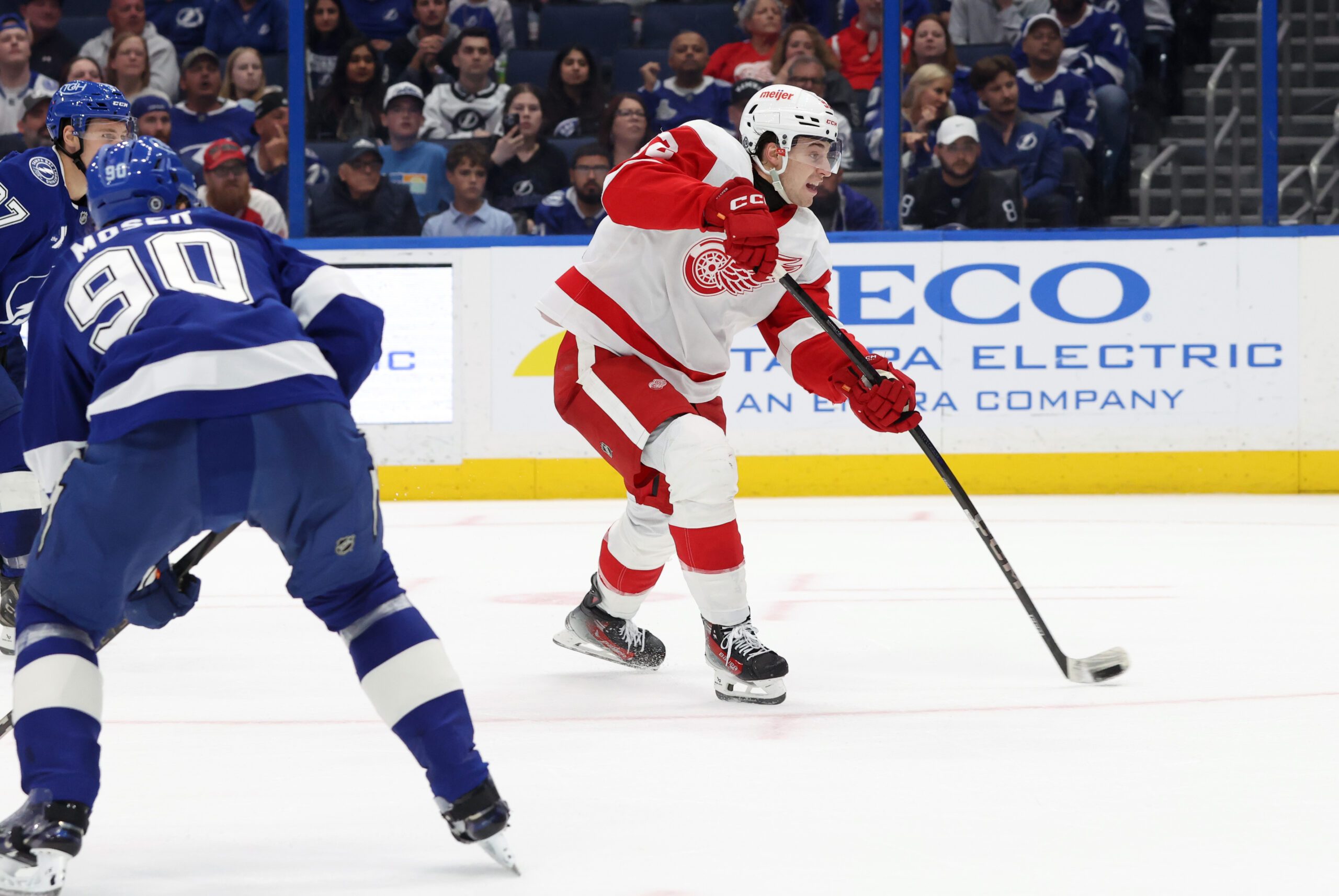 Apr 11, 2025; Tampa, Florida, USA; Detroit Red Wings right wing Alex DeBrincat (93) shoots and scores the game winning goal against the Tampa Bay Lightning during overtime at Amalie Arena. Mandatory Credit: Kim Klement Neitzel-Imagn Images
