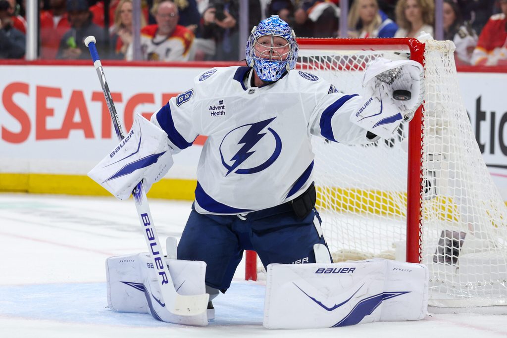 Apr 26, 2025; Sunrise, Florida, USA; Tampa Bay Lightning goaltender Andrei Vasilevskiy (88) makes a save against the Florida Panthers in the first period during game three of the first round of the 2025 Stanley Cup Playoffs at Amerant Bank Arena. Mandatory Credit: Nathan Ray Seebeck-Imagn Images