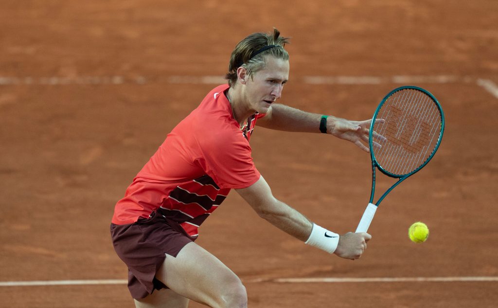 May 30, 2025; Paris, FR; Sebastian Korda of the United States returns a shot during his match against Frances Tiafoe of the United States on day six at Roland Garros Stadium.  Mandatory Credit: Susan Mullane-Imagn Images