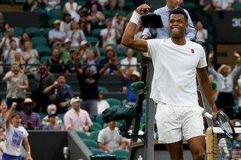 Jun 30, 2025; Wimbledon, United Kingdom; Giovanni Mpetshi Perricard (FRA) reacts after winning a point against Taylor Fritz (USA)(not pictured) on day one of The Championships, Wimbledon 2025 at All England Lawn Tennis and Croquet Club. Mandatory Credit: Geoff Burke-Imagn Images