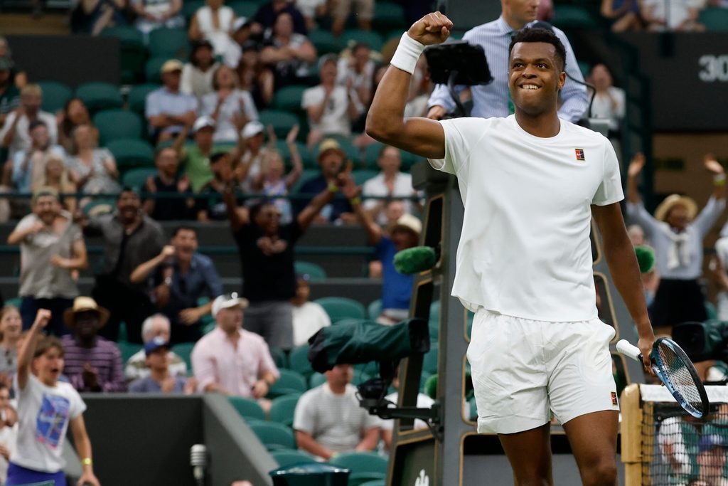 Jun 30, 2025; Wimbledon, United Kingdom; Giovanni Mpetshi Perricard (FRA) reacts after winning a point against Taylor Fritz (USA)(not pictured) on day one of The Championships, Wimbledon 2025 at All England Lawn Tennis and Croquet Club. Mandatory Credit: Geoff Burke-Imagn Images