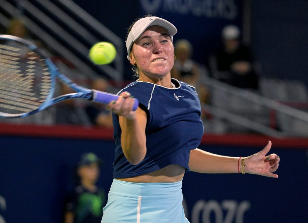 Jul 29, 2025; Montreal, QC, Canada; Sofia Kenin (USA) returns the ball against Victoria Mboko (CAN) in second round play at IGA Stadium. Mandatory Credit: Eric Bolte-Imagn Images