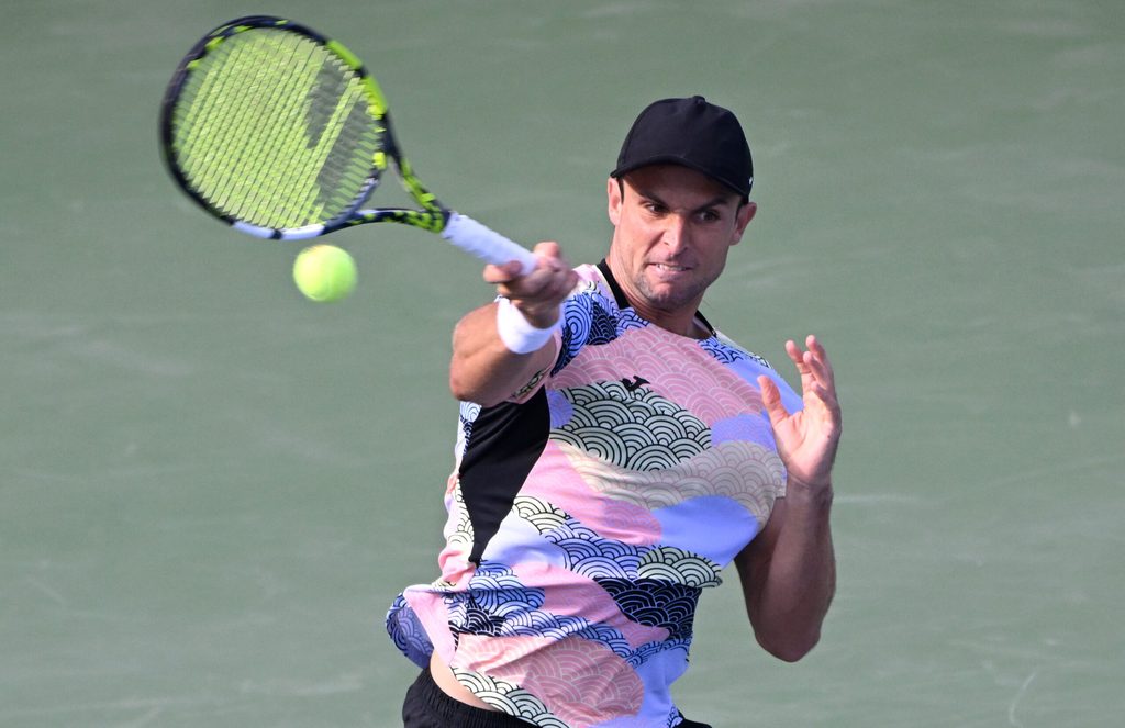 Aug 1, 2025; Toronto, ON, Canada; Aleksandar Vukic (AUS)  plays a shot against Frances Tiafoe (USA) during third round play at Sobeys Stadium. Mandatory Credit: Dan Hamilton-Imagn Images