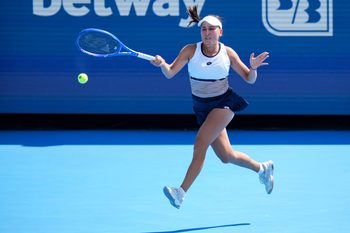 Aug 8, 2025; Cincinnati, OH, USA; Kamilla Rakhimova (RUS) reacts after returning a shot against Maria Sakkari (GRE) during the Cincinnati Open at the Lindner Family Tennis Center. Mandatory Credit: Aaron Doster-Imagn Images