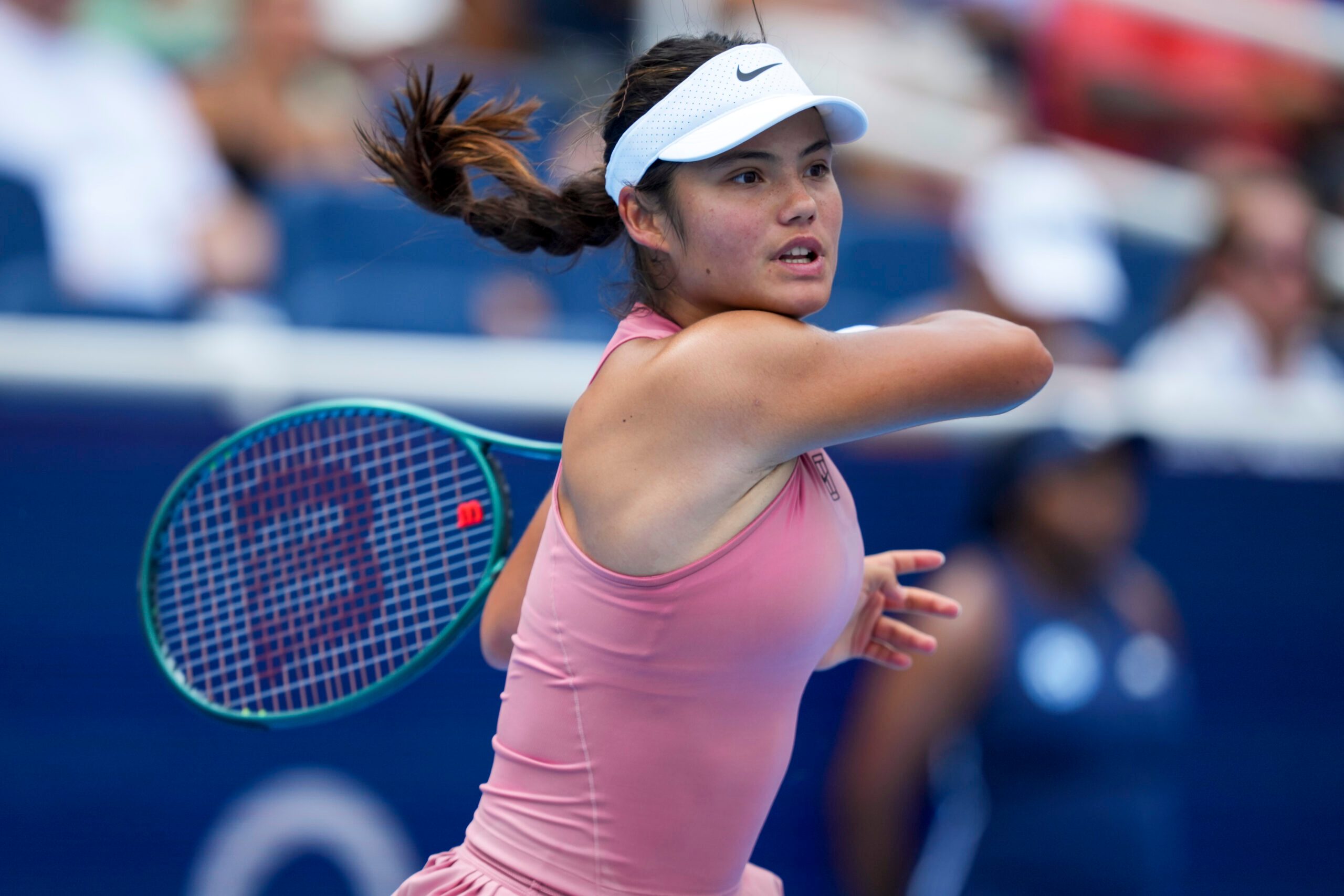 Aug 11, 2025; Cincinnati, OH, USA; Emma Raducanu (GBR) returns a shot against Aryna Sabalenka (BLR) during the Cincinnati Open at the Lindner Family Tennis Center. Mandatory Credit: Aaron Doster-Imagn Images