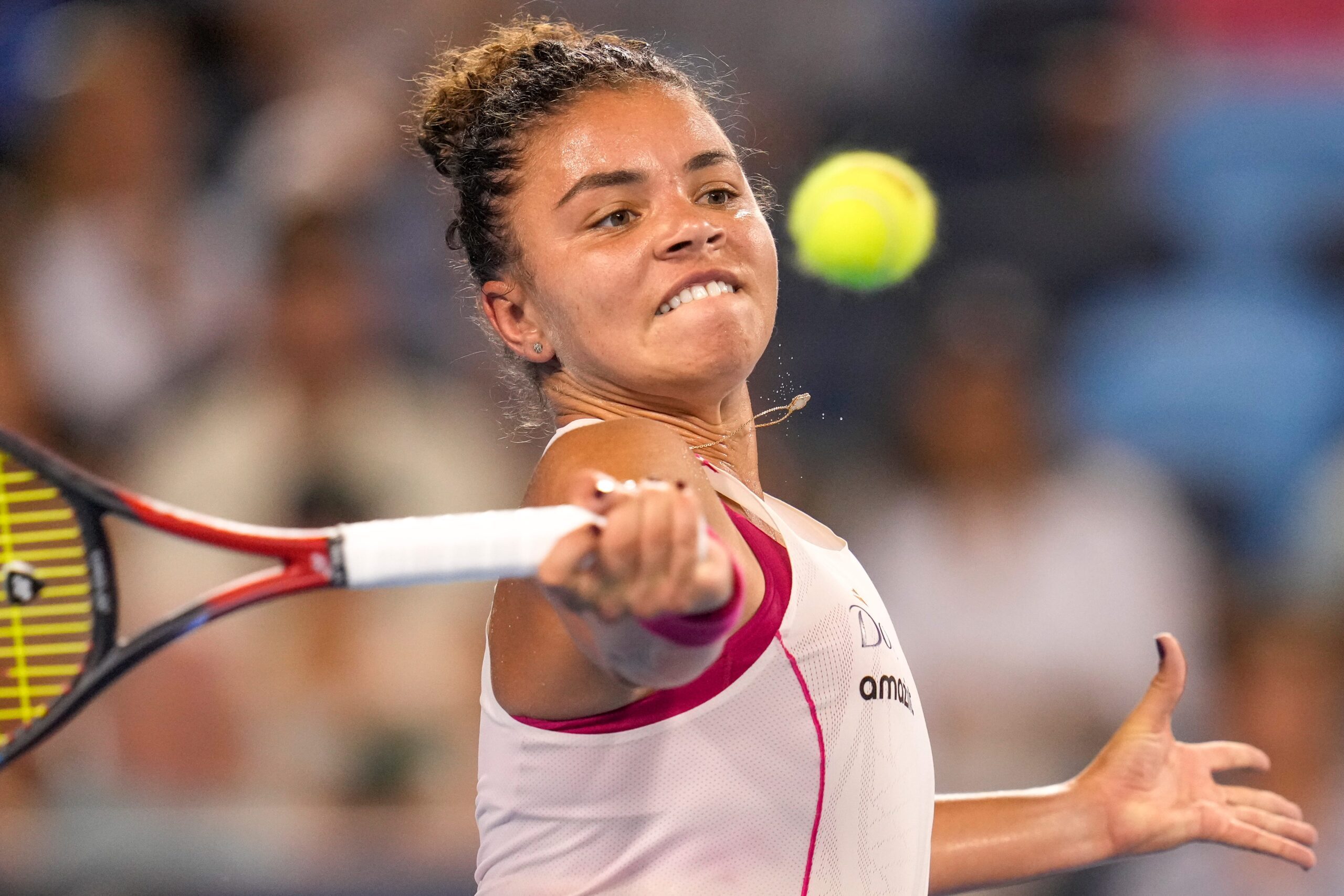 Jasmine Paolini returns a shot in the Cincinnati Open quarterfinal match between Coco Gauff and Jasmine Paolini at the Lindner Family Tennis Center in Mason, Ohio, on Friday, Aug. 15, 2025. Paolini won 2-6, 6-4, 6-3.