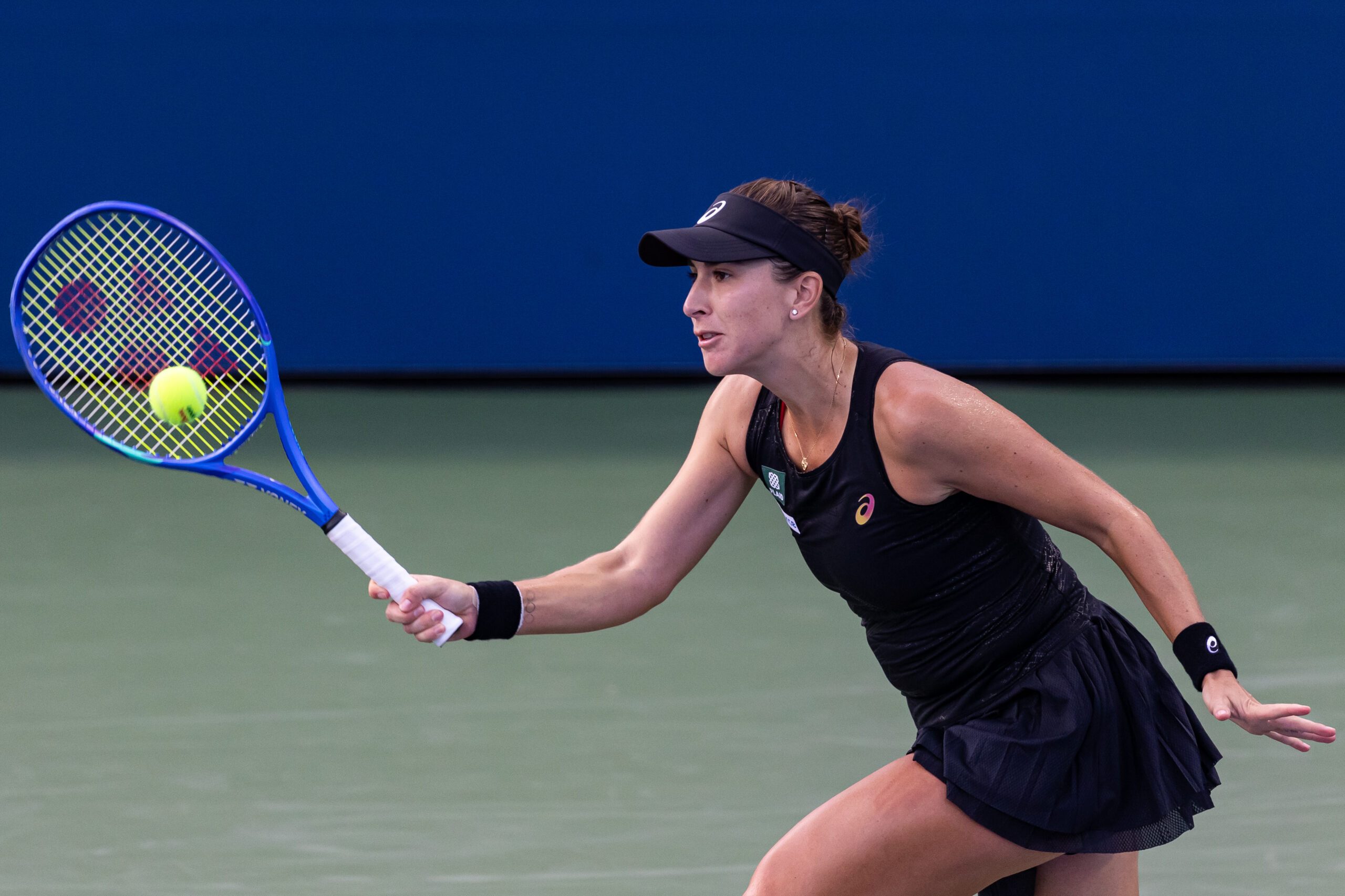 Aug 24, 2025; Flushing, NY, USA; Belinda Bencic of Switzerland in action against Zhang Shuai of China in the first round of the women’s singles at the US Open at Billie Jean King National Tennis Centre. Mandatory Credit: Mike Frey-Imagn Images