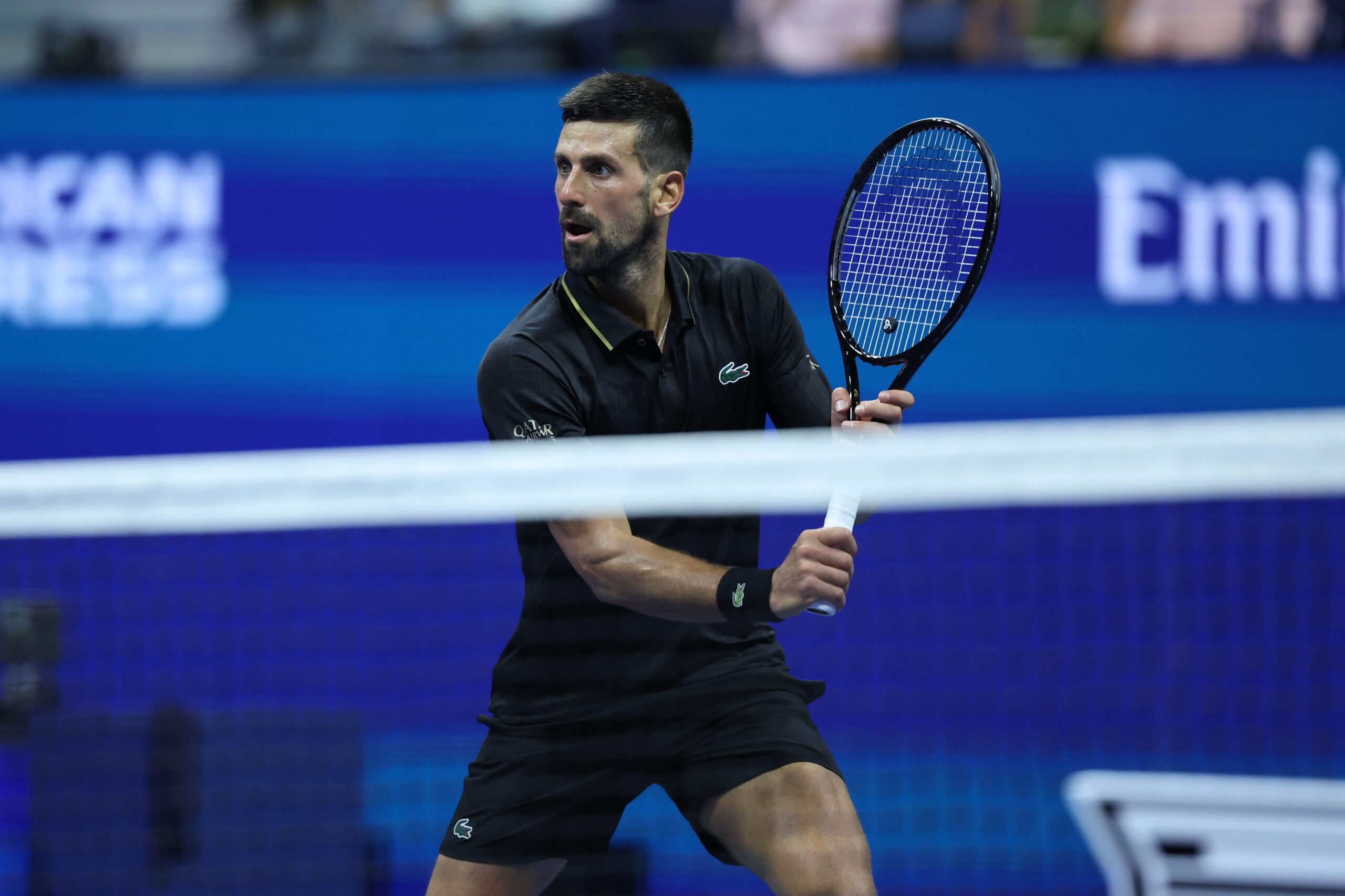 Aug 24, 2025; Flushing, NY, USA; Novak Djokovic (SRB) hits the ball against Learner Tien (USA) (not pictured) on day one of the 2025 U.S. Open tennis tournament at USTA Billie Jean King National Tennis Center. Mandatory Credit: Amber Searls-Imagn Images