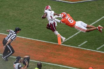 Troy Trojans receiver Tray Taylor (8) scores a touchdown near Clemson cornerback Ricardo Jones (6) during the first quarter at Memorial Stadium in Clemson, S.C. Saturday, September 6, 2025.
