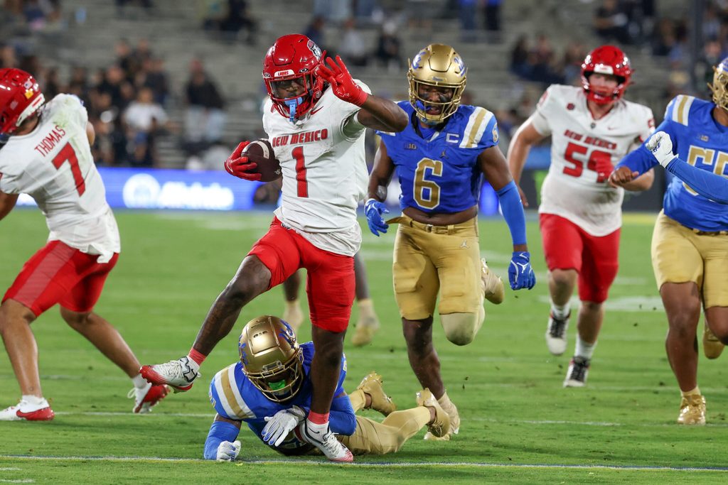 Sep 12, 2025; Pasadena, California, USA; New Mexico Lobos running back Damon Bankston (1) runs with the ball for a touchdown during the fourth quarter against the UCLA Bruins at Rose Bowl. Mandatory Credit: Kiyoshi Mio-Imagn Images