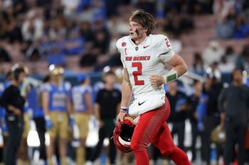 Sep 12, 2025; Pasadena, California, USA;  New Mexico Lobos quarterback Jack Layne (2) runs back to the sideline during the second quarter against the UCLA Bruins at Rose Bowl. Mandatory Credit: Kiyoshi Mio-Imagn Images
