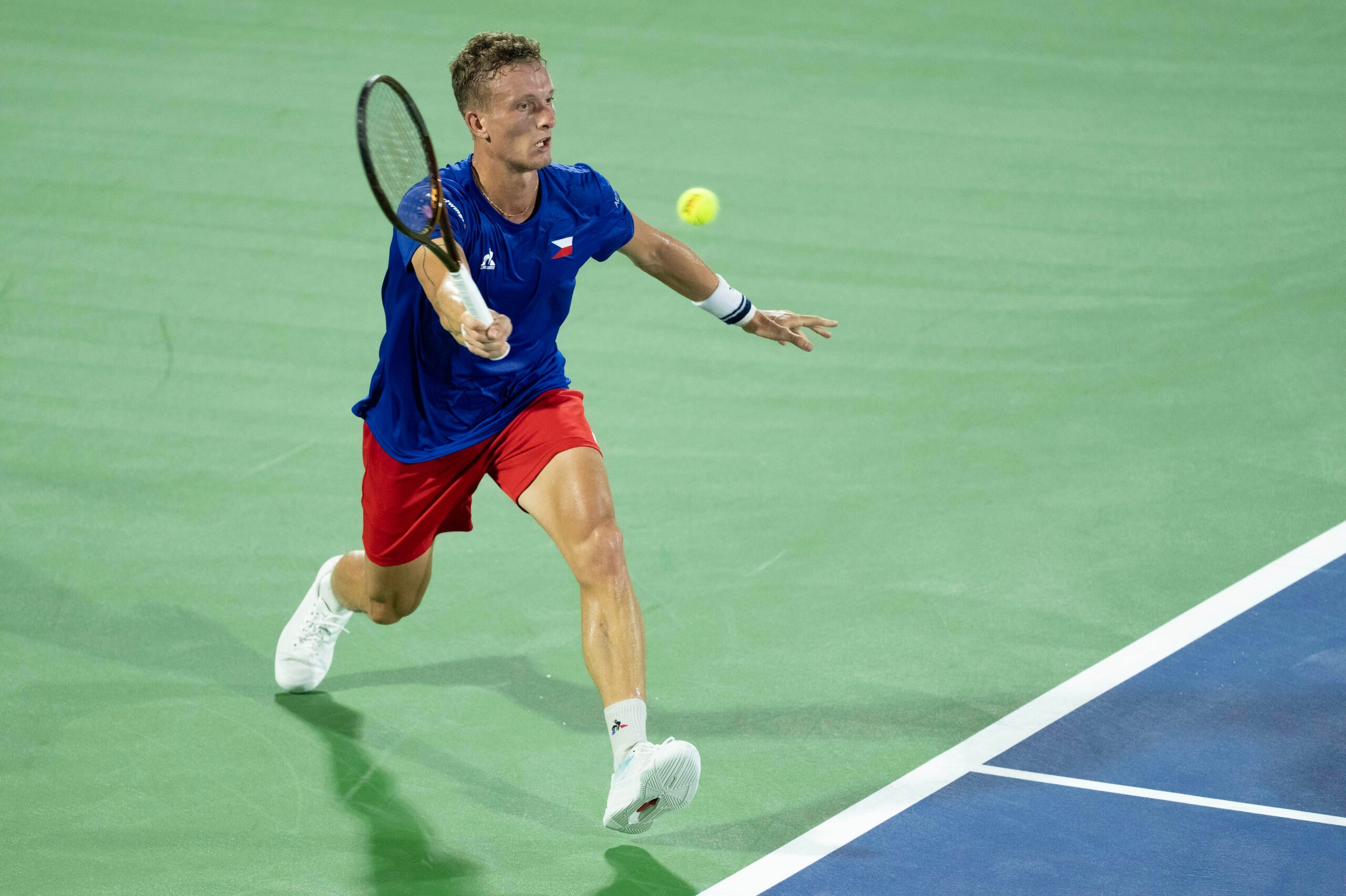 Sep 13, 2025; Delray Beach, FL, USA; Jiri Lehecka of Czechia returns a shot against Taylor Fritz of the United States in their Davis Cup match at Delray Beach Tennis Center. Mandatory Credit: Susan Mullane-Imagn Images