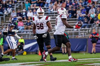Sep 20, 2025; East Hartford, Connecticut, USA; Ball State Cardinals running back Qua Ashley (9) runs the ball for a touchdown against the Connecticut Huskies in the second half at Pratt & Whitney Stadium at Rentschler Field. Mandatory Credit: David Butler II-Imagn Images