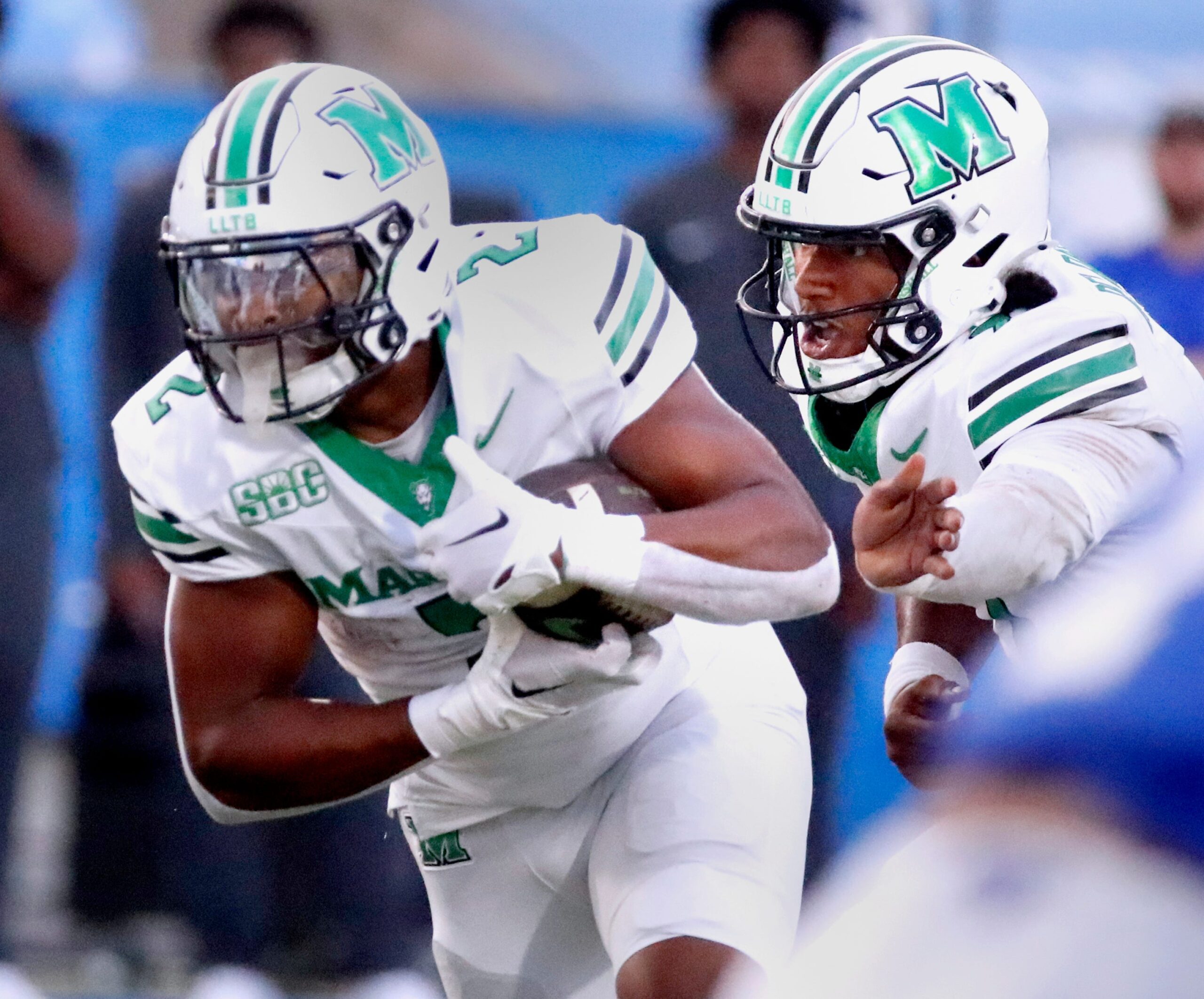 Marshall quarterback Carlos Del Rio-Wilson (7) hands the ball off to Marshall running back Michael Allen (2) during MTSU's Homecoming football game on Saturday, Sept. 20, 2025.