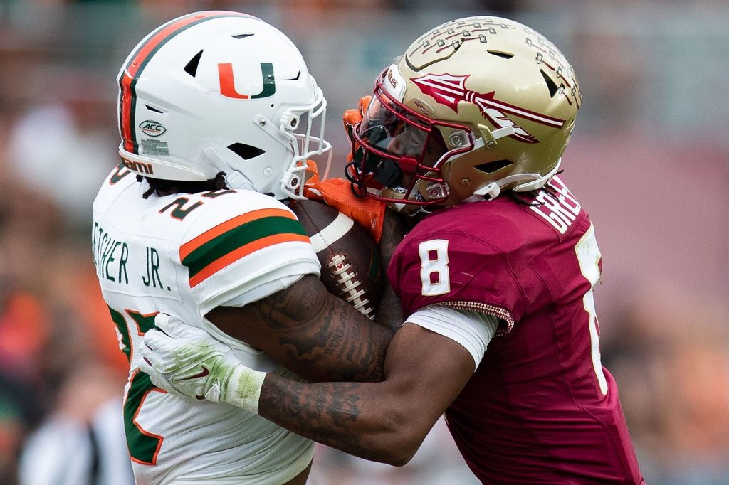 Florida State defensive back Renardo Green (8) tackles Miami running back Mark Fletcher Jr. (22) during a college football game Saturday, Nov. 11, 2023, at Doak Campbell Stadium in Tallahassee, Florida.