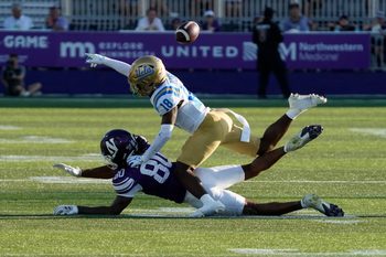 Sep 27, 2025; Evanston, Illinois, USA; UCLA Bruins defensive back Rodrick Pleasant (18) defends Northwestern Wildcats wide receiver Hayden Eligon II (80) during the second half at Northwestern Medicine Field at Martin Stadium. Mandatory Credit: David Banks-Imagn Images