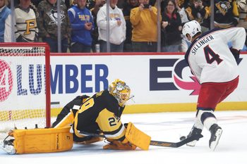 Sep 27, 2025; Pittsburgh, Pennsylvania, USA;  Pittsburgh Penguins goaltender Marc-Andre Fleury (29) poke checks the puck from Columbus Blue Jackets center Cole Sillinger (4) in the shootout at PPG Paints Arena. Mandatory Credit: Charles LeClaire-Imagn Images