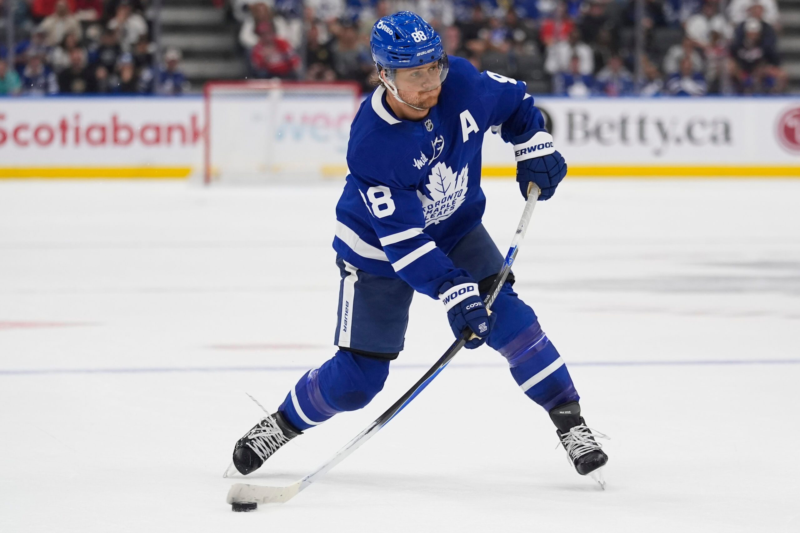 Sep 27, 2025; Toronto, Ontario, CAN; Toronto Maple Leafs forward William Nylander (88) shoots the puck against the Montreal Canadiens during the third period at Scotiabank Arena. Mandatory Credit: John E. Sokolowski-Imagn Images