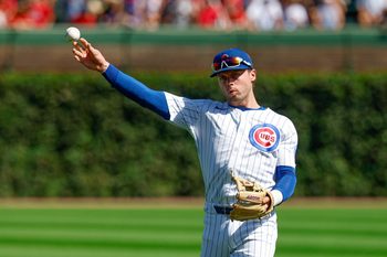 Sep 27, 2025; Chicago, Illinois, USA; Chicago Cubs second baseman Nico Hoerner (2) warms up before a baseball game against the St. Louis Cardinals at Wrigley Field. Mandatory Credit: Kamil Krzaczynski-Imagn Images