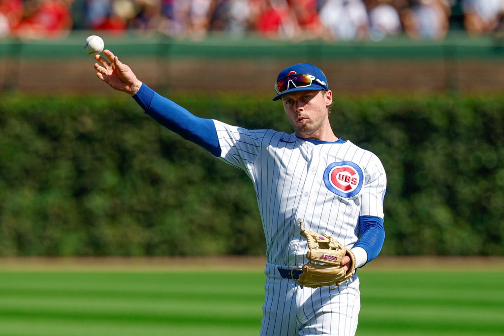 Sep 27, 2025; Chicago, Illinois, USA; Chicago Cubs second baseman Nico Hoerner (2) warms up before a baseball game against the St. Louis Cardinals at Wrigley Field. Mandatory Credit: Kamil Krzaczynski-Imagn Images