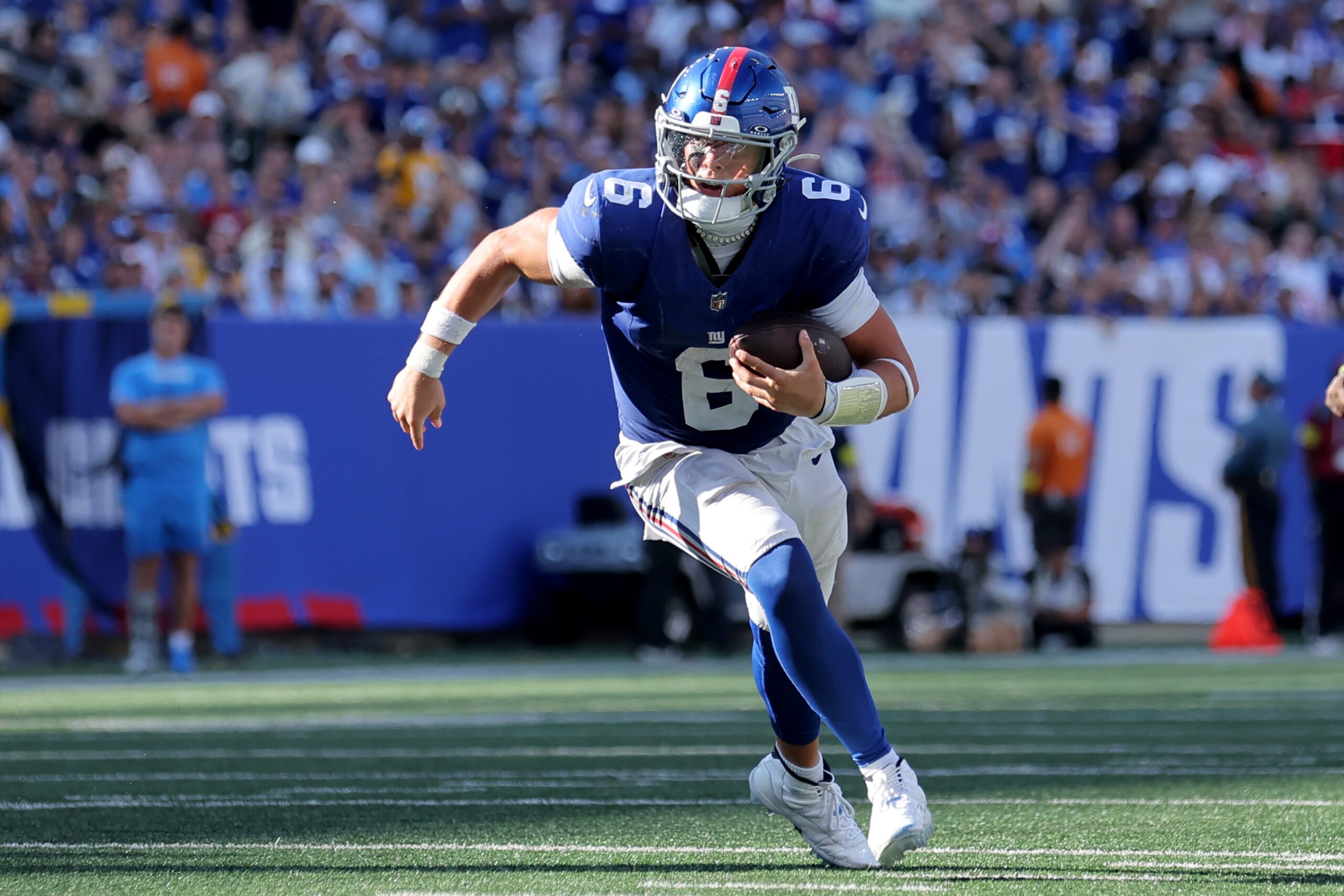 Sep 28, 2025; East Rutherford, New Jersey, USA; New York Giants quarterback Jaxson Dart (6) runs with the ball against the Los Angeles Chargers during the fourth quarter at MetLife Stadium. Mandatory Credit: Brad Penner-Imagn Images