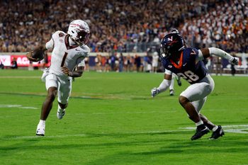 Sep 26, 2025; Charlottesville, Virginia, USA; Florida State Seminoles quarterback Tommy Castellanos (1) runs with the ball as Virginia Cavaliers defensive back Donavon Platt (28) chases at Scott Stadium. Mandatory Credit: Geoff Burke-Imagn Images