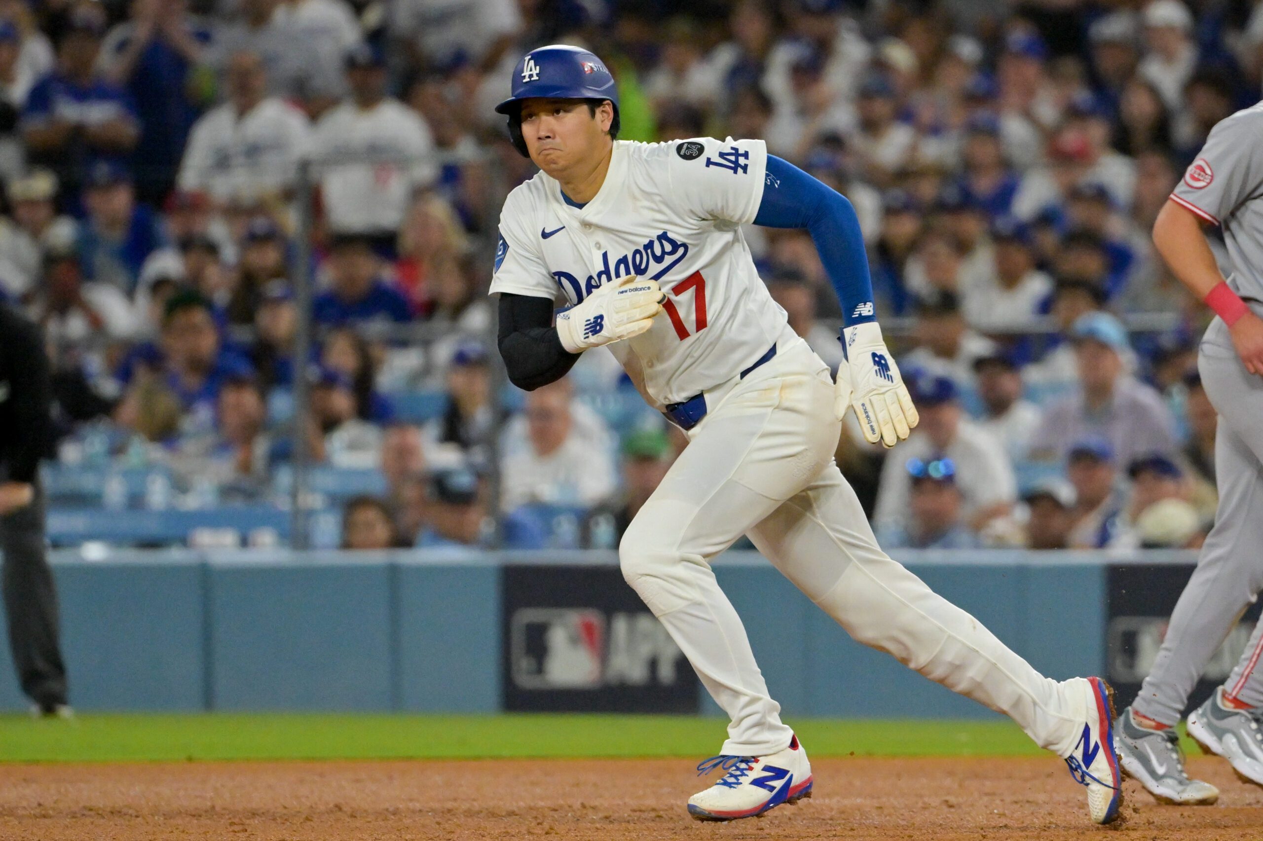 Oct 1, 2025; Los Angeles, California, USA; Los Angeles Dodgers designated hitter Shohei Ohtani (17) runs towards second base against the Cincinnati Reds in the seventh inningduring game two of the Wildcard round for the 2025 MLB playoffs at Dodger Stadium. Mandatory Credit: Jayne Kamin-Oncea-Imagn Images