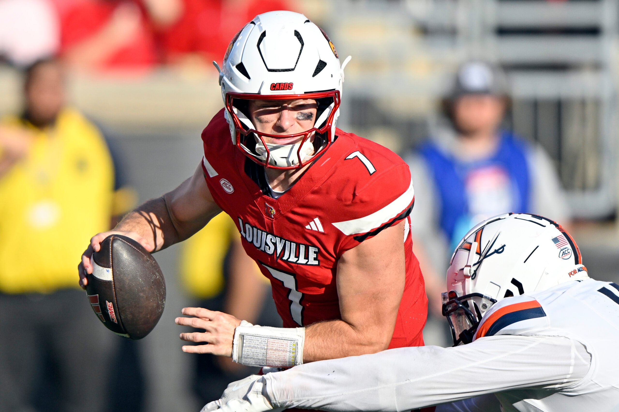 Oct 4, 2025; Louisville, Kentucky, USA; Virginia Cavaliers defensive end Mitchell Melton (17) sacks Louisville Cardinals quarterback Miller Moss (7) during the second half at L&N Federal Credit Union Stadium. Virginia defeated Louisville 30-27. Mandatory Credit: Jamie Rhodes-Imagn Images