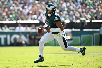 Oct 5, 2025; Philadelphia, Pennsylvania, USA; Philadelphia Eagles quarterback Jalen Hurts (1) runs against the Denver Broncos in the first quarter at Lincoln Financial Field. Mandatory Credit: Eric Hartline-Imagn Images