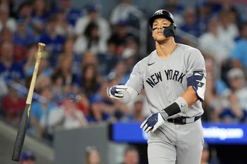 Oct 5, 2025; Toronto, Ontario, CAN; New York Yankees right fielder Aaron Judge (99) reacts after a walk in the ninth inning against the Toronto Blue Jays during game two of the ALDS round for the 2025 MLB playoffs at Rogers Centre. Mandatory Credit: John E. Sokolowski-Imagn Images