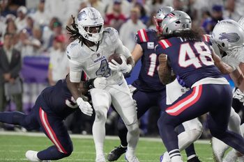 Buffalo Bills running back James Cook carries the ball during firsts half action at Highmark Stadium in Orchard Park on Oct. 5, 2025.