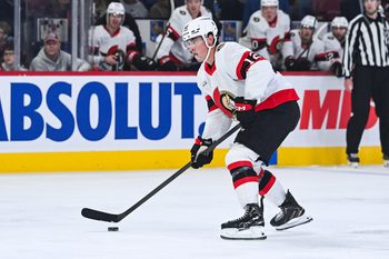 Oct 4, 2025; Montreal, Quebec, CAN; Ottawa Senators center Shane Pinto (12) plays the puck against the Montreal Canadiens during the second period at Bell Centre. Mandatory Credit: David Kirouac-Imagn Images