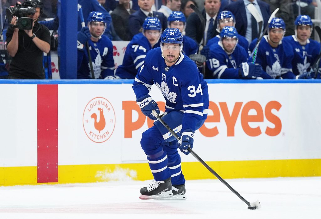 Oct 8, 2025; Toronto, Ontario, CAN; Toronto Maple Leafs center Auston Matthews (34) skates with the puck against the Montreal Canadiens during the first period at Scotiabank Arena. Mandatory Credit: Nick Turchiaro-Imagn Images