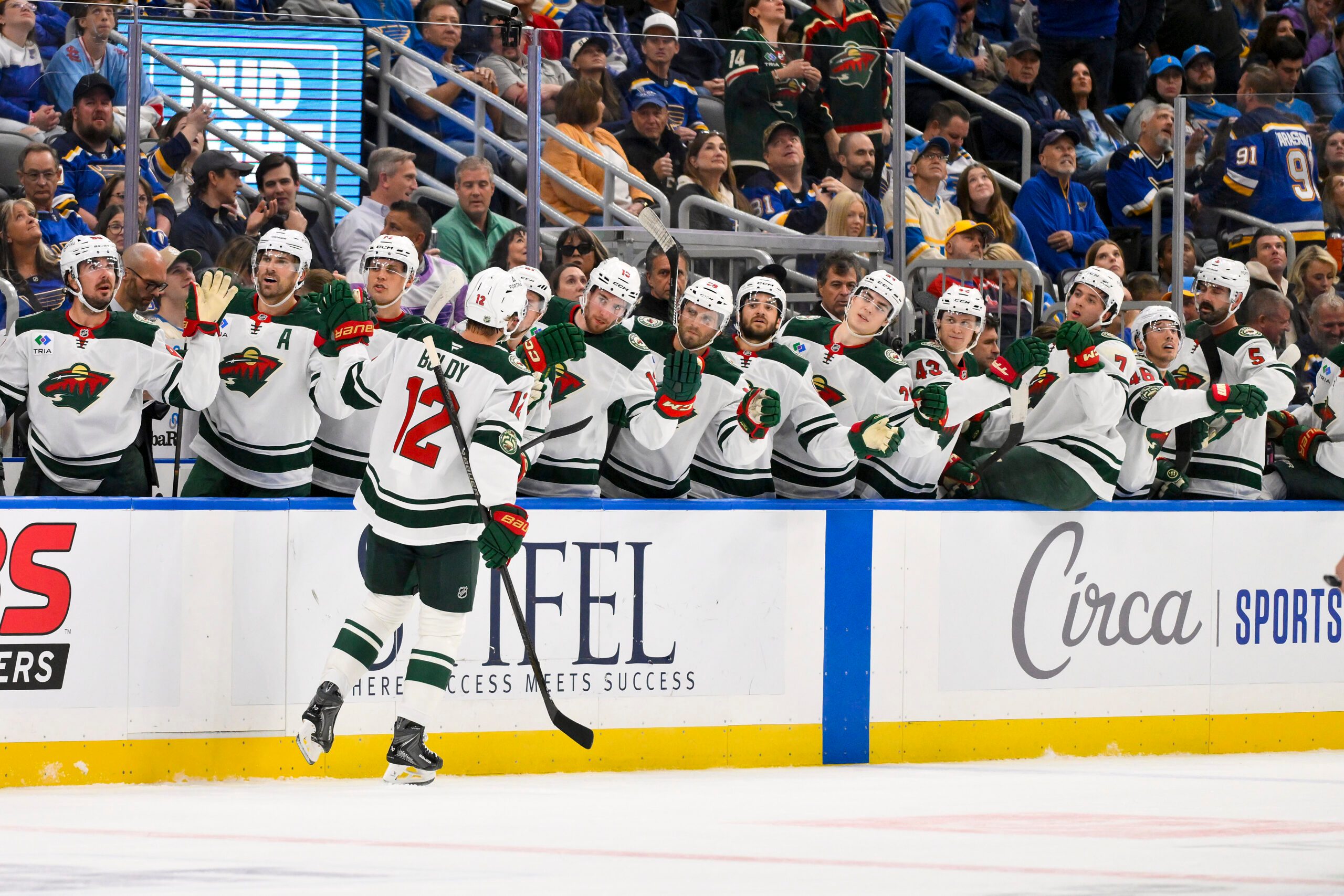 Oct 9, 2025; St. Louis, Missouri, USA; Minnesota Wild left wing Matt Boldy (12) is congratulated by teammates after scoring against the St. Louis Blues during the first period at Enterprise Center. Mandatory Credit: Jeff Curry-Imagn Images