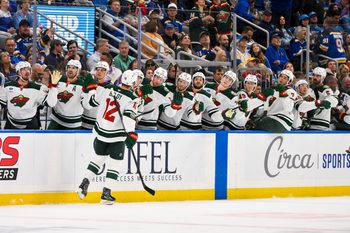 Oct 9, 2025; St. Louis, Missouri, USA; Minnesota Wild left wing Matt Boldy (12) is congratulated by teammates after scoring against the St. Louis Blues during the first period at Enterprise Center. Mandatory Credit: Jeff Curry-Imagn Images