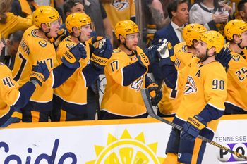 Oct 9, 2025; Nashville, Tennessee, USA; Nashville Predators center Ryan O'Reilly (90) celebrates with his teammates after scoring a goal against the Columbus Blue Jackets during the third period at Bridgestone Arena. Mandatory Credit: Steve Roberts-Imagn Images
