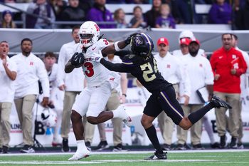 Oct 10, 2025; Seattle, Washington, USA; Rutgers Scarlet Knights running back Antwan Raymond (3) stiff arms Washington Huskies running back Adam Mohammed (24) during the first half at Husky Stadium. Mandatory Credit: Kevin Ng-Imagn Images