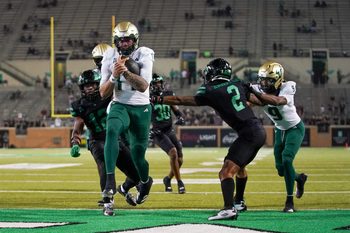 Oct 10, 2025; Denton, Texas, USA; South Florida Bulls quarterback Byrum Brown (17) carries the ball for a touchdown against the North Texas Mean Green during the second half of a game at DATCU Stadium. Mandatory Credit: Raymond Carlin III-Imagn Images