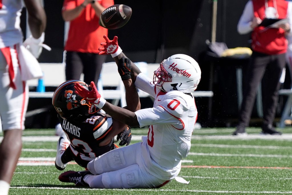 Oklahoma State Cowboys safety Kenneth Harris (23) knocks the ball away as Houston Cougars wide receiver Amare Thomas (0) misses the catch during a college football game between the Oklahoma State Cowboys (OSU) and the Houston Cougars at Boone Pickens Stadium in Stillwater, Okla., Saturday, Oct. 11, 2025. Houston won 39-17.