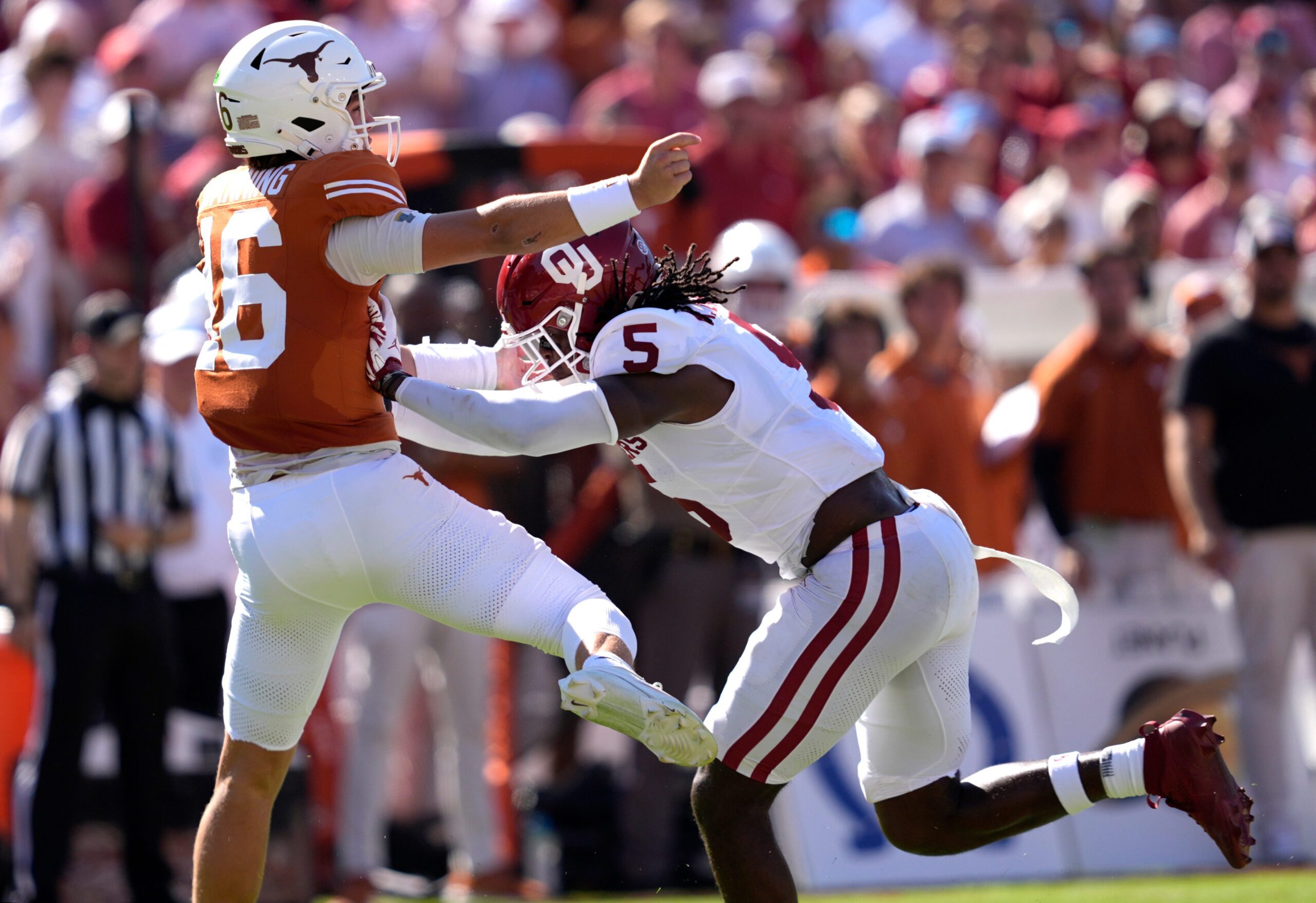 Oklahoma Sooners linebacker Kendal Daniels (5) pressures Texas Longhorns quarterback Arch Manning (16) in the first half of the Red River Rivalry college football game between the University of Oklahoma Sooners and the Texas Longhorn at the Cotton Bowl Stadium in Dallas, Texas, Saturday, Oct. 11, 2025.